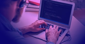 hands on a laptop keyboard conducting remote code execution of lateral movement tactics 