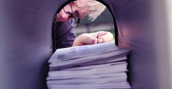 Person checking their mail box
