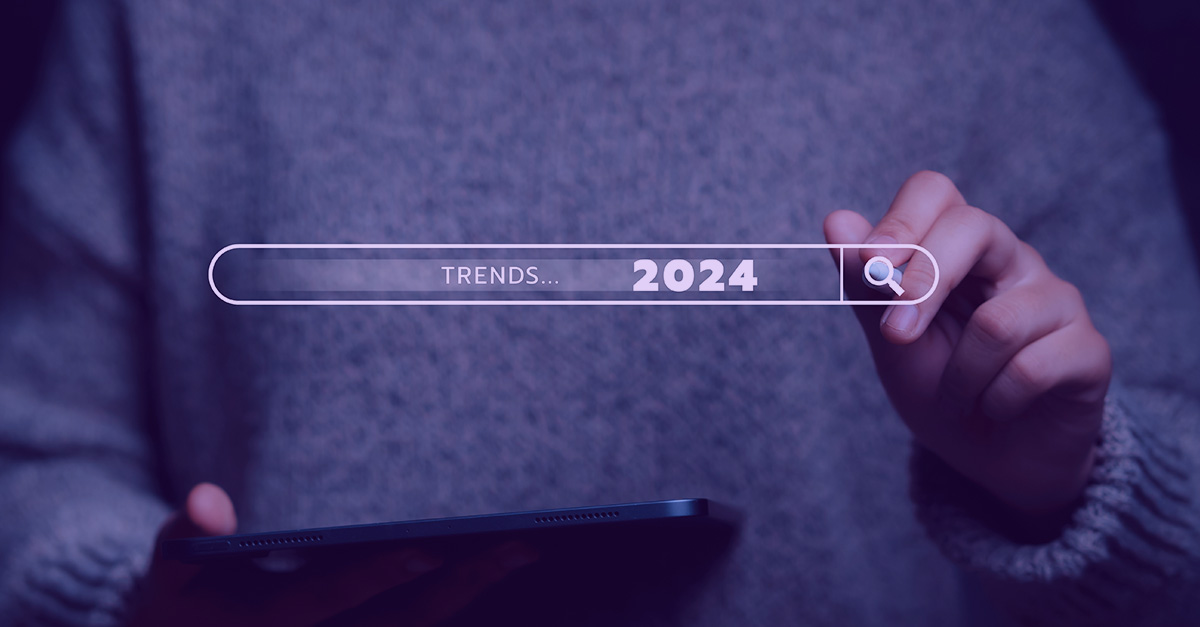 a search bar with “trends… 2024” written in it overlaid on a picture of a cybersecurity expert